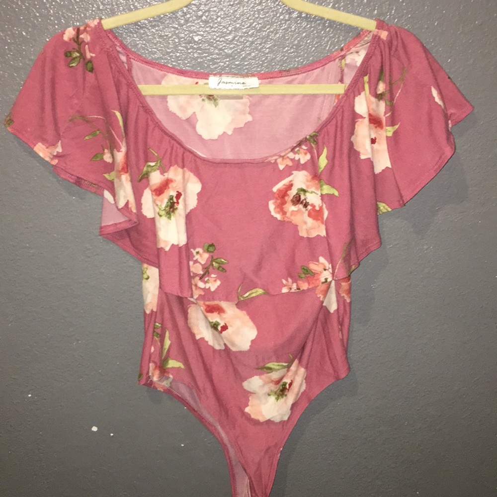 Pink body suit with flowers on them!